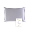 A smooth, silver-gray silk pillowcase with a crescent moon design.