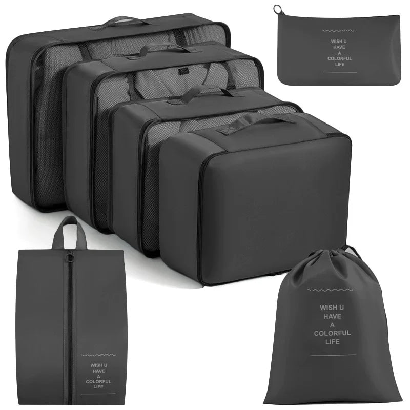 A set of black travel storage organizers including a zippered pouch and a rectangular box.