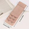 A beige adjustable bra extender strap is shown with measurements and a wooden frame.