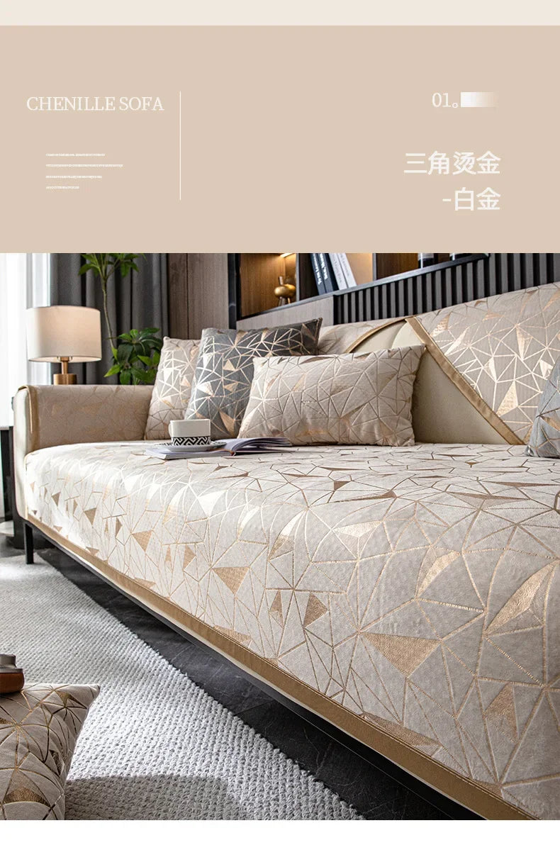 A luxurious beige and gold patterned sofa cover displayed on a bed, featuring geometric designs.