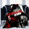 A dark horror themed throw blanket featuring a graphic of Michael Myers with blood splatter.