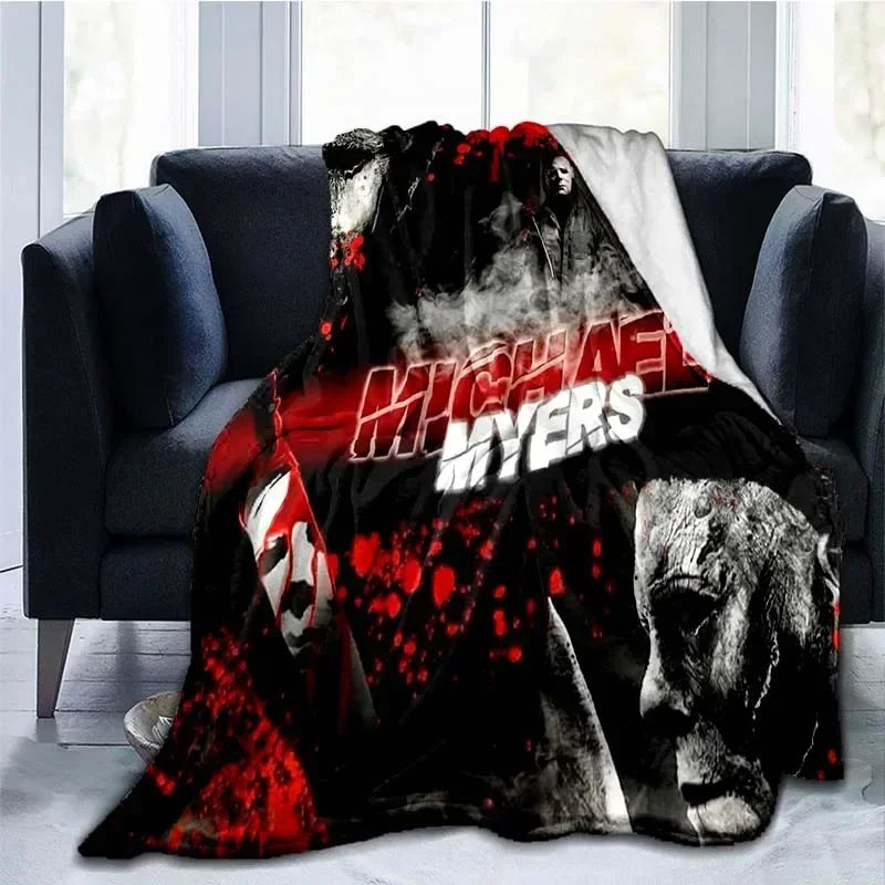 A dark horror themed throw blanket featuring a graphic of Michael Myers with blood splatter.