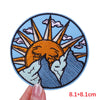 An embroidered patch featuring a stylized orange sun rising over blue mountains and clouds.