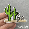Embroidered patch featuring a cactus and a lizard on a beige background