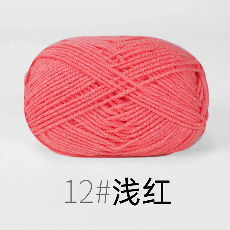 A ball of bright coral pink knitting yarn labeled 12# 浅红.