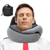 A man is using an adjustable memory foam travel neck pillow for support.