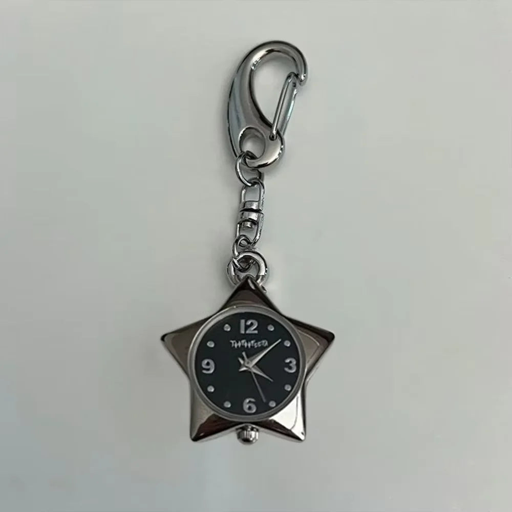 Silver chain keychain featuring a star-shaped pocket watch with a black face and silver hands.