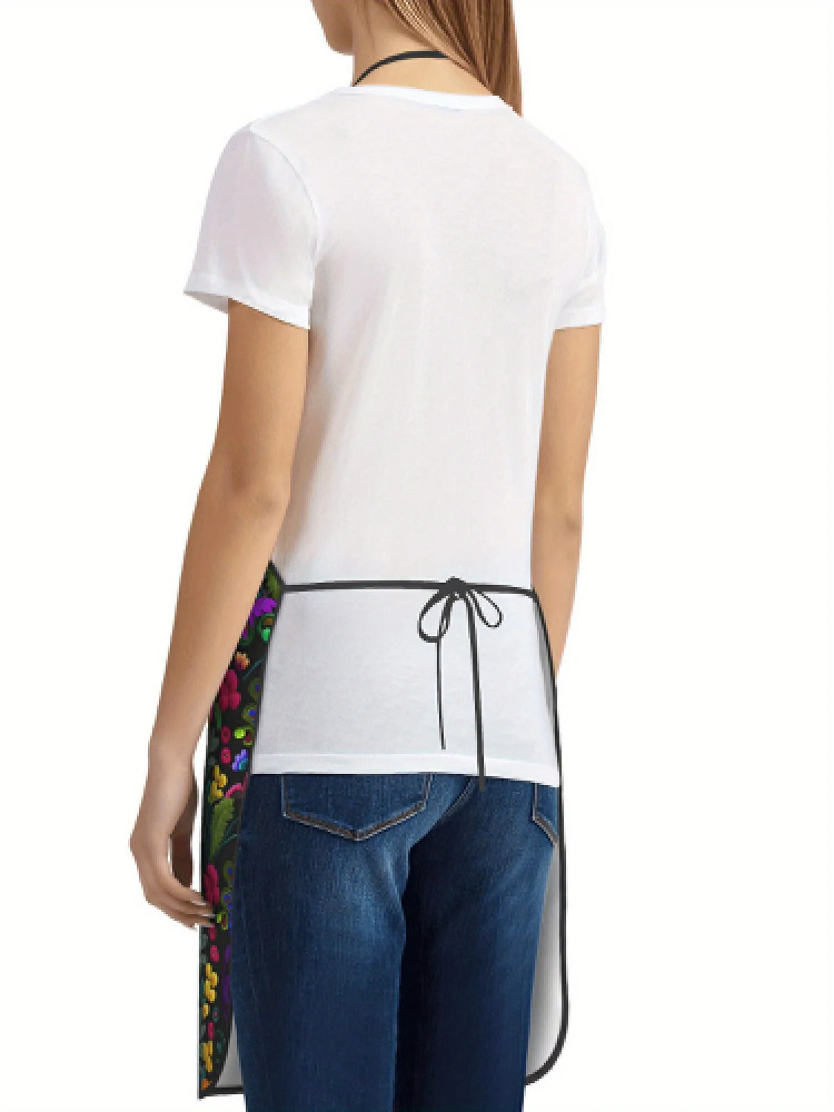 A white t-shirt worn by a person, featuring a black floral tatting apron tied around the waist.