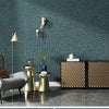 Close-up of a teal linen texture wallpaper used as a wall covering in an interior setting.