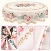 Vintage pink rose sunflower floral tablecloth displayed on a round table with fabric swatches.