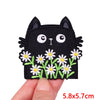 Black cartoon cat embroidered iron-on patch with white floral accents