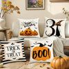 Set of four Halloween cushion covers featuring ghost, pumpkin, and skull designs on white fabric.