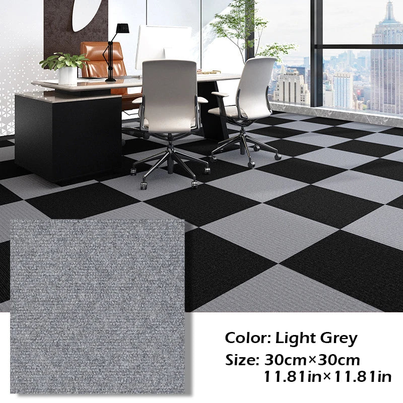 Light grey and black checkered carpet tiles with modern office furniture and a cityscape view