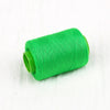 A coil of bright green handmade sewing threads.