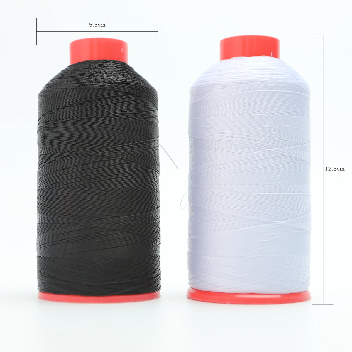 A spool of black heavy duty nylon sewing thread with a red base and a spool of white heavy duty nylon sewing thread with a re