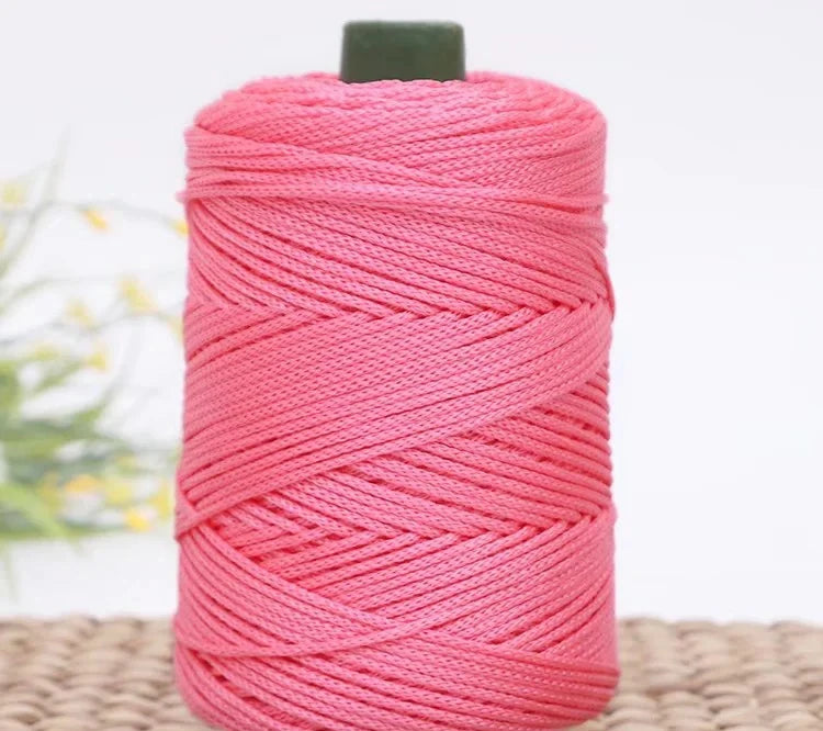 Pink crochet ice rope in a spool with a dark green cap, ready for DIY crafts.
