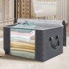 A gray foldable clothes organizer bag with a clear window displaying folded shirts and sweaters.