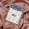 A package of six plastic safety pins for hijab accessories is displayed on pink fabric.