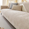 A beige chenille sofa cushion cover with light gray accent pillows on a modern sofa.