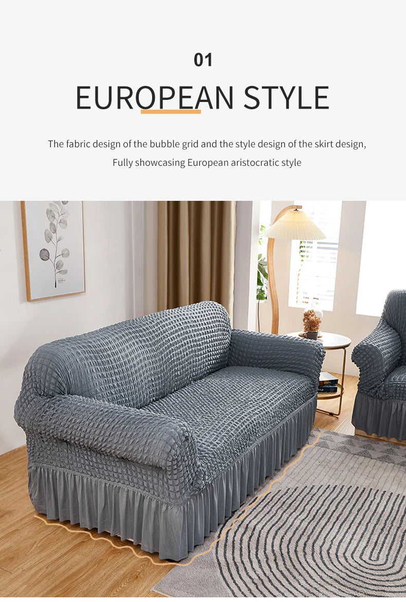 A gray stretch knit sofa cover featuring a bubble lattice texture displayed in a living room setting.