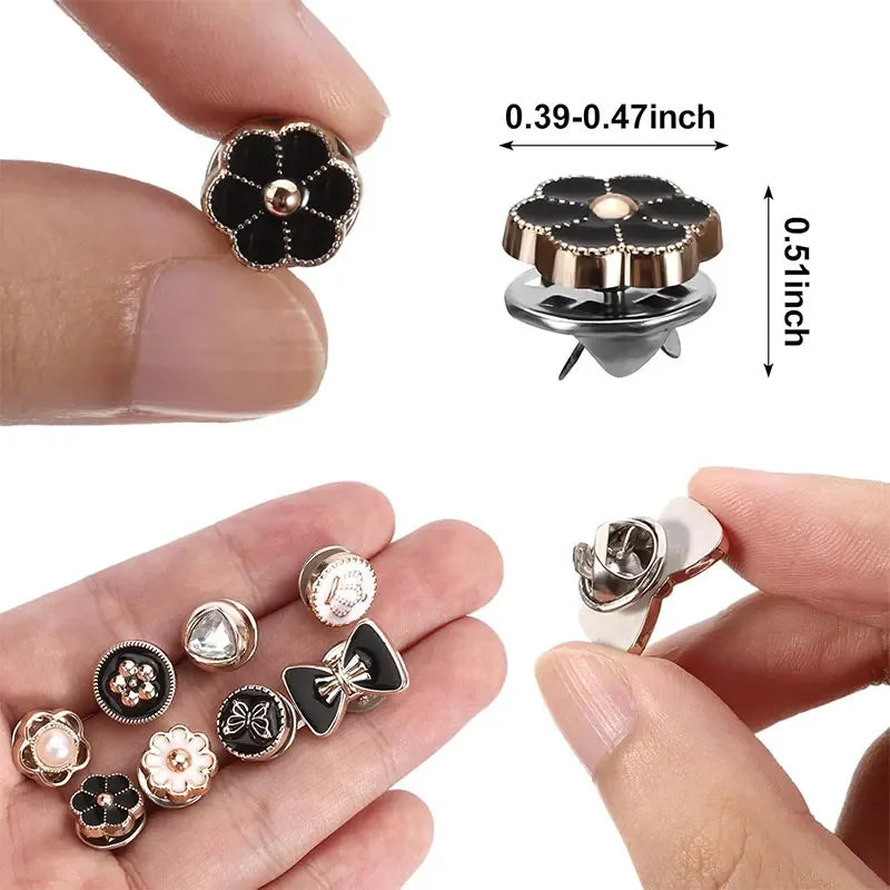 A set of instant removable pearl brooch buttons in various sizes and finishes shown on a hand.