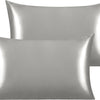 A pair of silky satin toddler pillowcases in a silver-gray color.