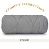 A tightly wound ball of gray thick polyester blended yarn for crafting.