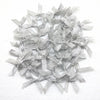 A pile of small silver satin ribbon bows for crafts and decor.