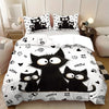 A black cat print bedding set featuring a large cat and several kittens on a white background.
