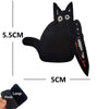 Black embroidered cat patch with yellow eyes and a loop hook