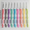 A set of ergonomic crochet hooks and needles in various colors including pink, purple, teal, and yellow.