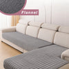 A light gray flannel sofa cover is displayed on a white L-shaped corner sofa.