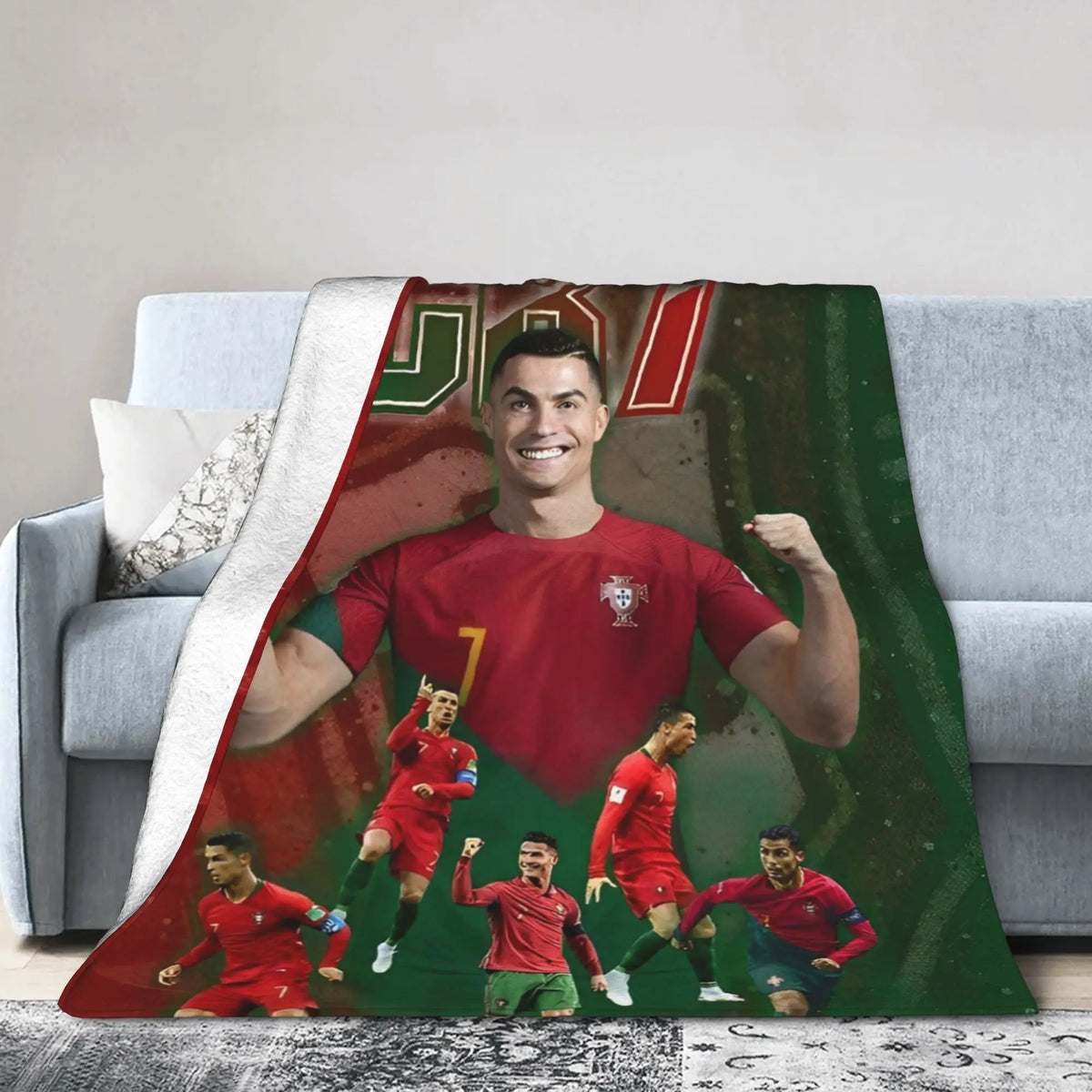A football team portrait featuring players in red jerseys on a large throw blanket.