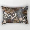 A decorative pillowcase featuring a tropical leaf print in shades of brown, beige, and gray on a dark blue background.