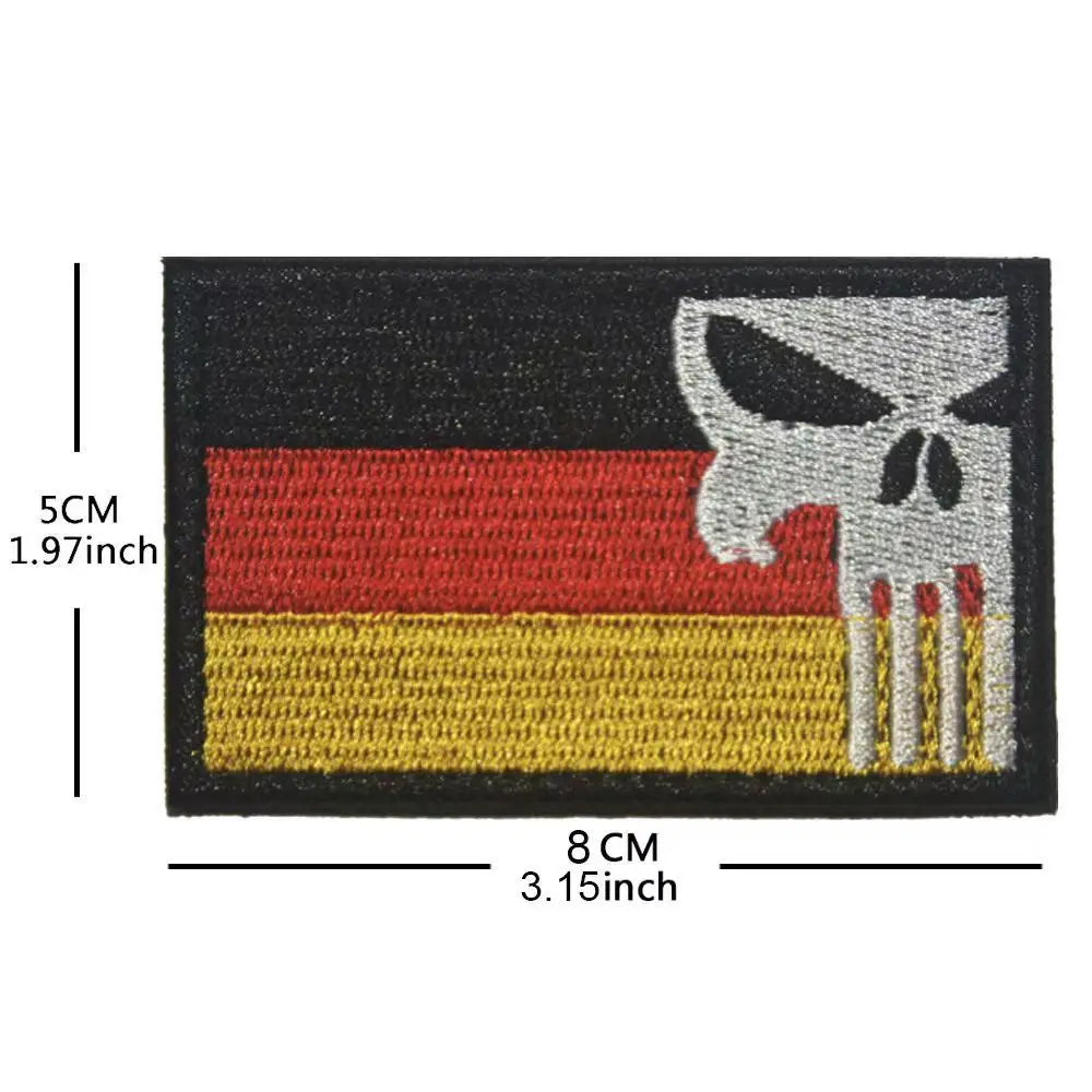 Black and yellow horizontal striped patch featuring a white skull design.