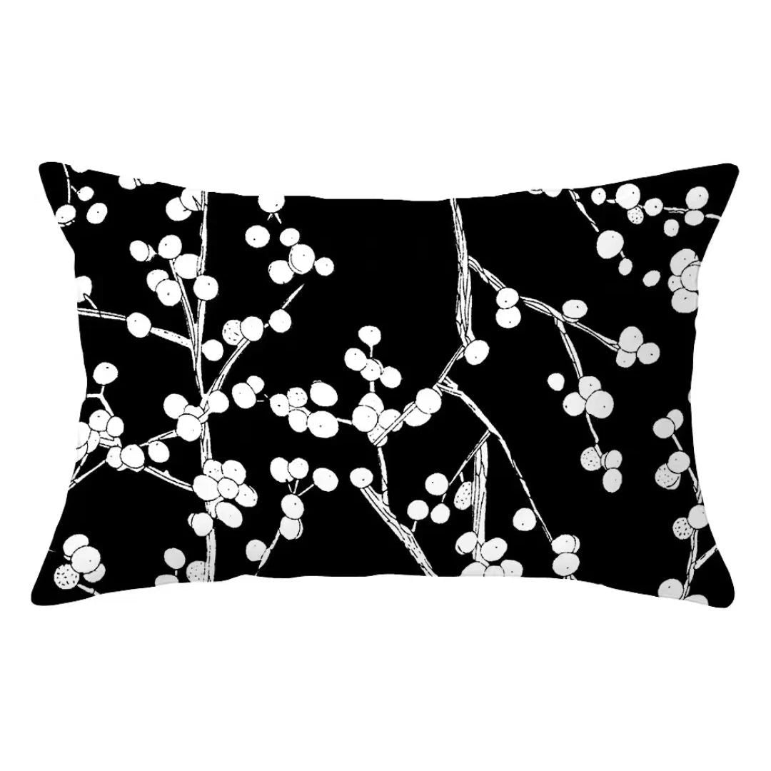 Black pillow cover with white minimalist decorative branches and berries pattern