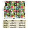 A colorful patterned throw blanket featuring various designs and text on a dark background.