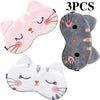 Three soft animal cartoon sleep masks featuring pink, gray, and white cats with visible whiskers and ears.