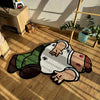 A funny cartoon rug depicting a person with a beard and various clothing items lying on a wooden floor.
