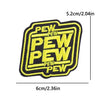 Yellow and black embroidered patch with the word PEW repeated on it