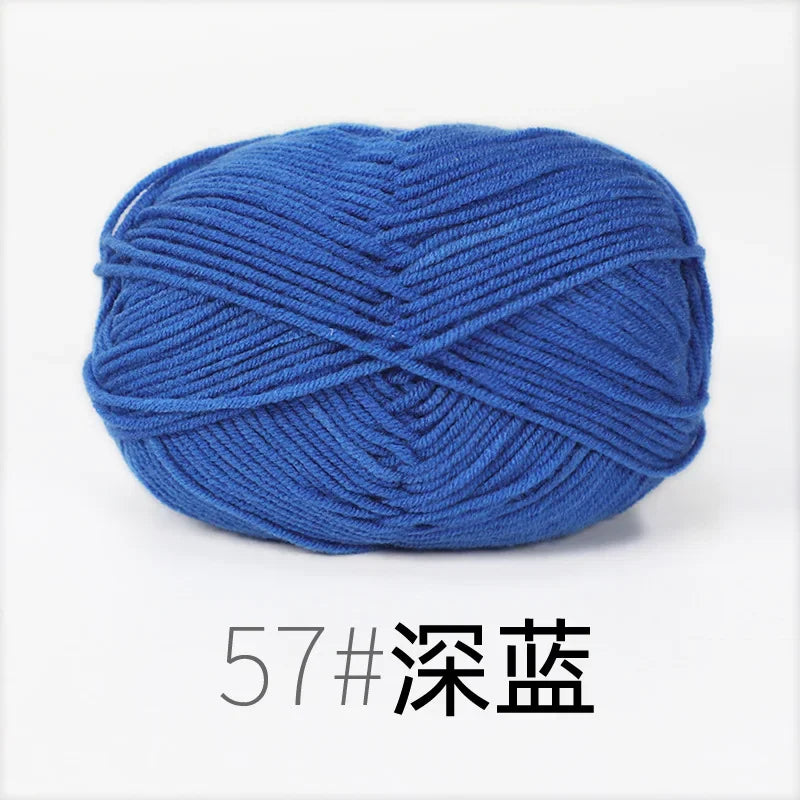 A ball of blue organic cotton 4ply knitting yarn for crafts.