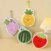 Cute plush fruit hanging decorations including a pineapple, grape, and strawberry