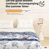 A white bed with a blue floral summer duvet and sheets, featuring soft polyester filling.