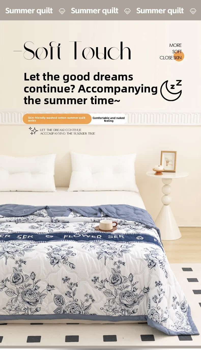 A white bed with a blue floral summer duvet and sheets, featuring soft polyester filling.