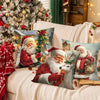 Two festive Christmas throw pillow covers featuring Santa and a reindeer on a snowy background