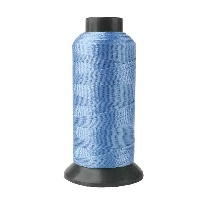 Roll of heavy duty 3-ply nylon sewing thread in light blue