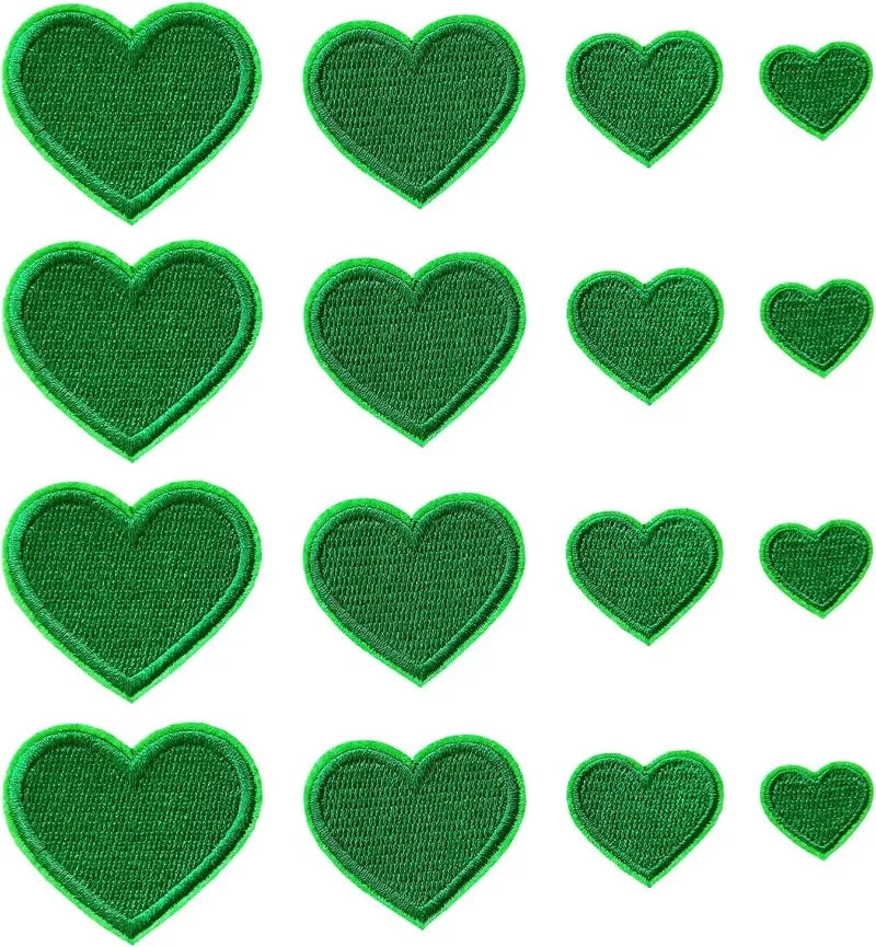 A collection of 24 iron-on love heart embroidered patches in green.