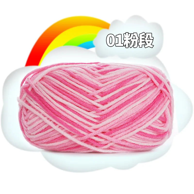 Pink premium milk cotton yarn skein with a rainbow background