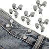 Adjustable button pins for jeans showing various sizes and styles on a denim fabric