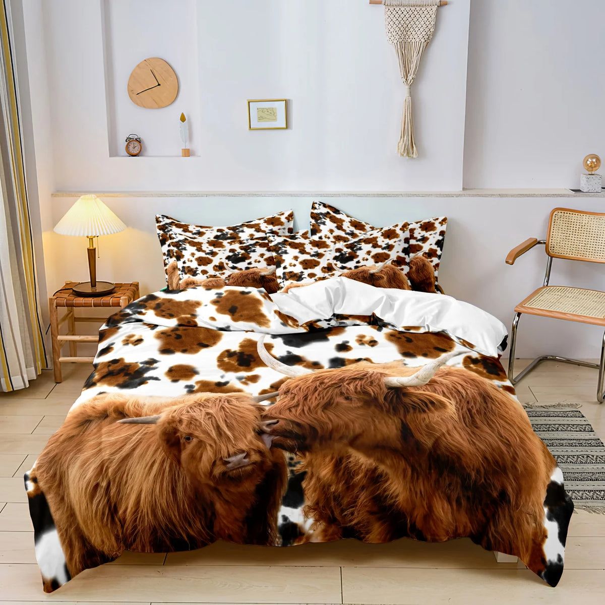 Highland cow print bedding set featuring brown and white patterns displayed on a bed.